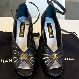 CHANEL Black Peep-Toe Heels with Gold Accent
